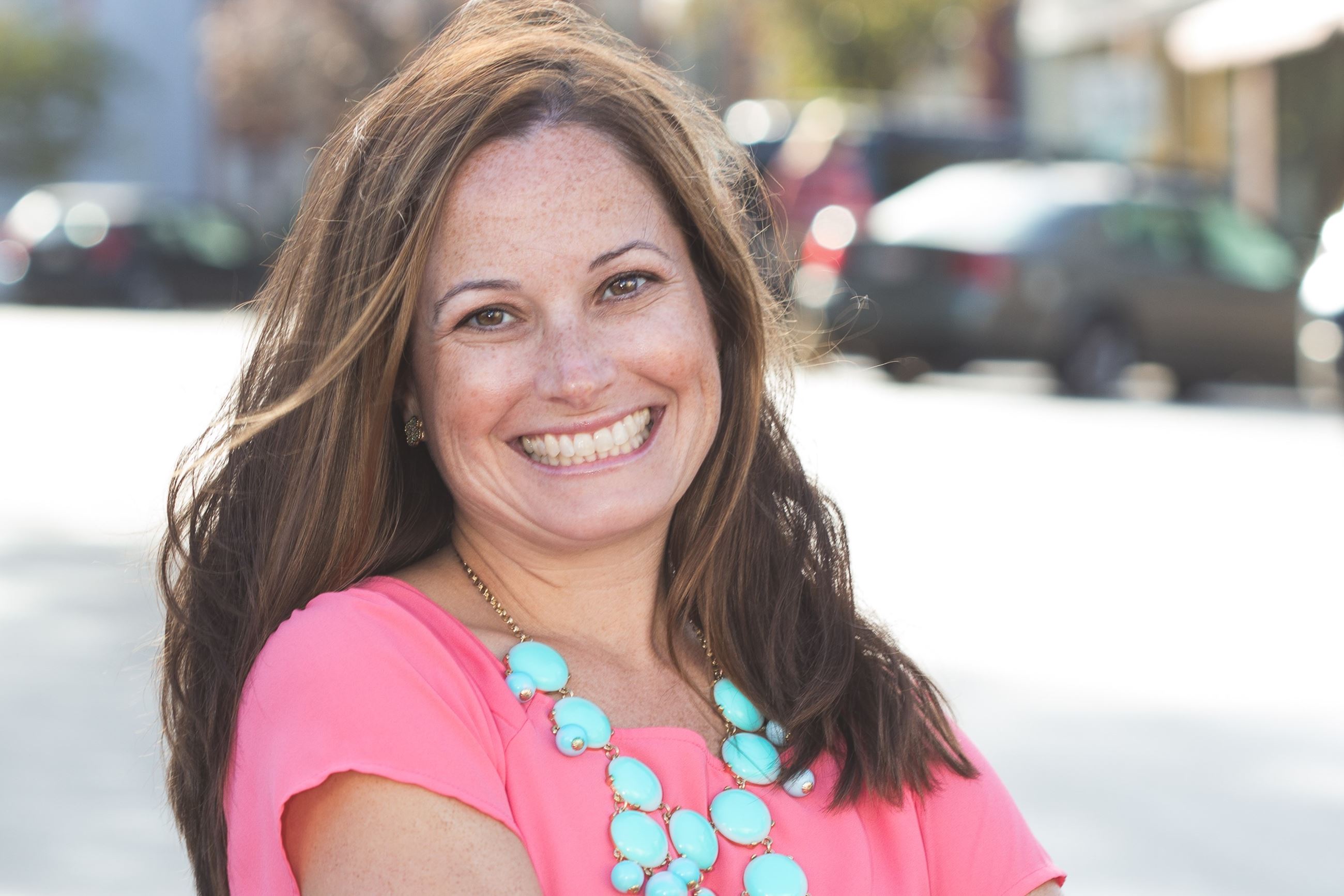 Photo of woman wearing pink shirt
