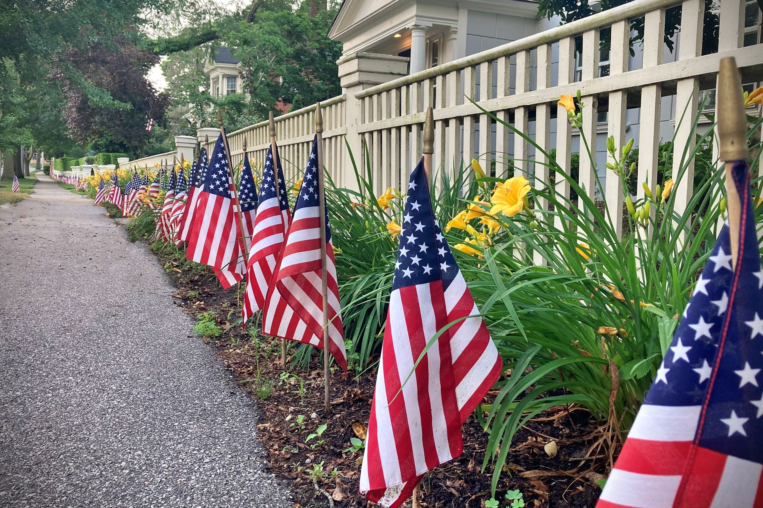 flags along fence and sidewalk