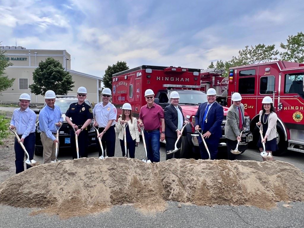 Groundbreaking people with shovels and hardhats