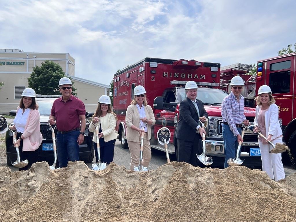 Groundbreaking people with shovels and hardhats