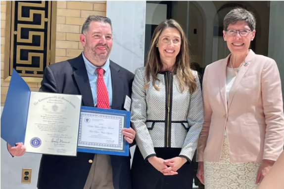 Three people receive award